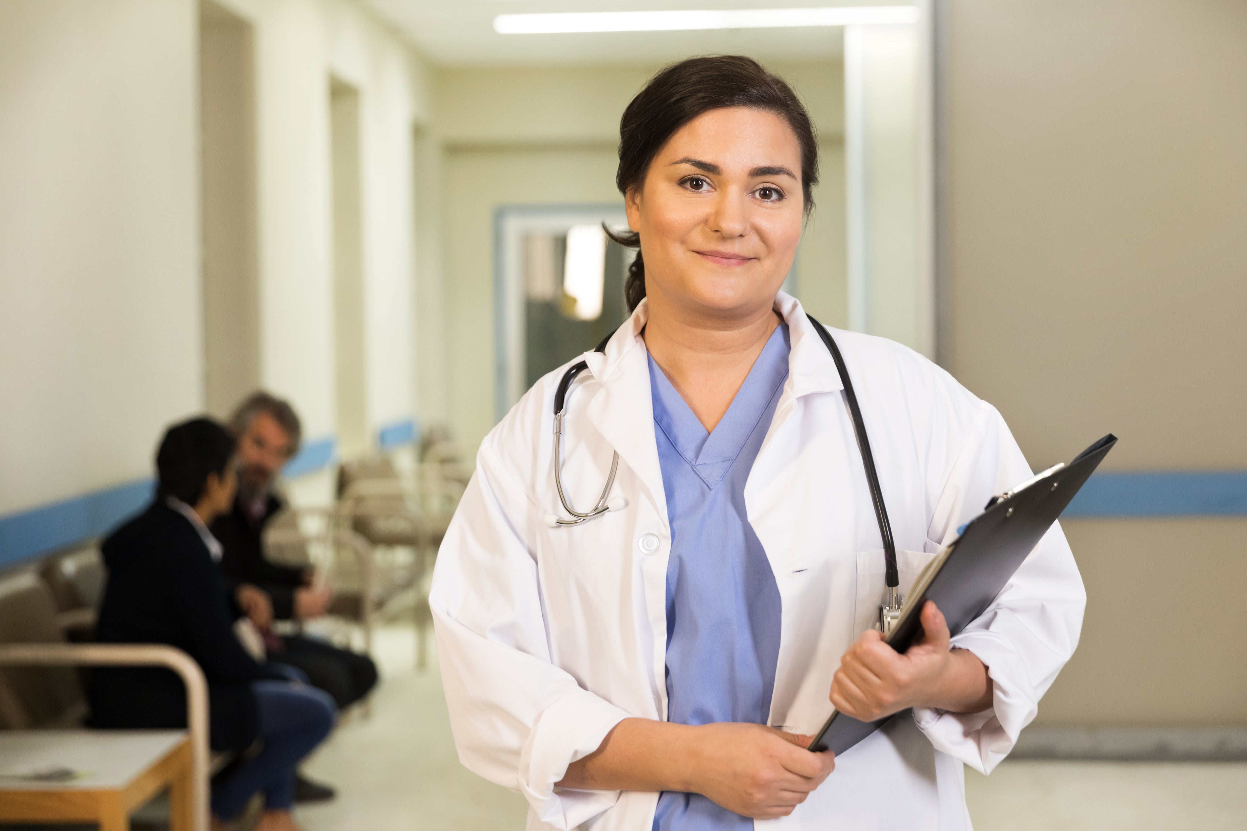 files/a-doctor-smiles-while-holding-her-clipboard.jpg